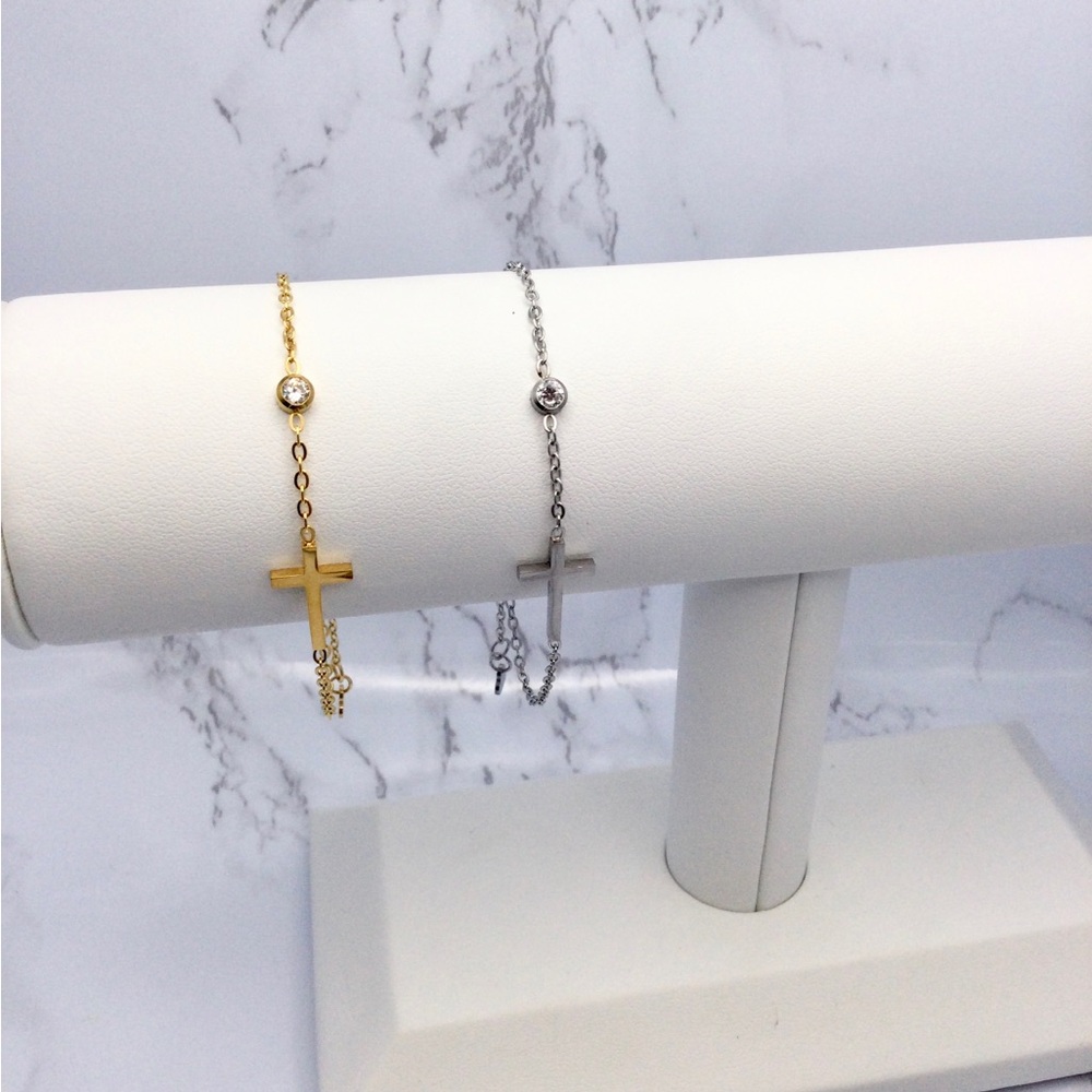 Dainty sideways cross and bezel set cz bracelet.